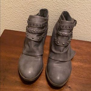 Gray boots with metal embellishments
